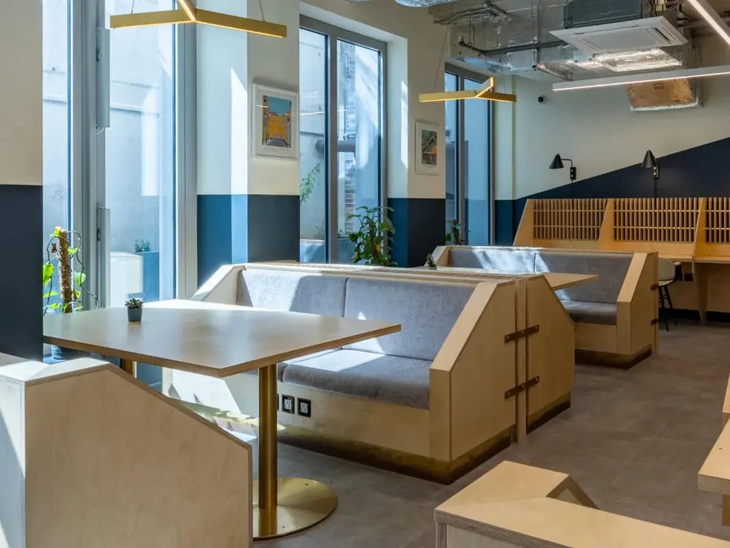 Seating booths tables and study desks communal area at Great Court in London Student Accommodation