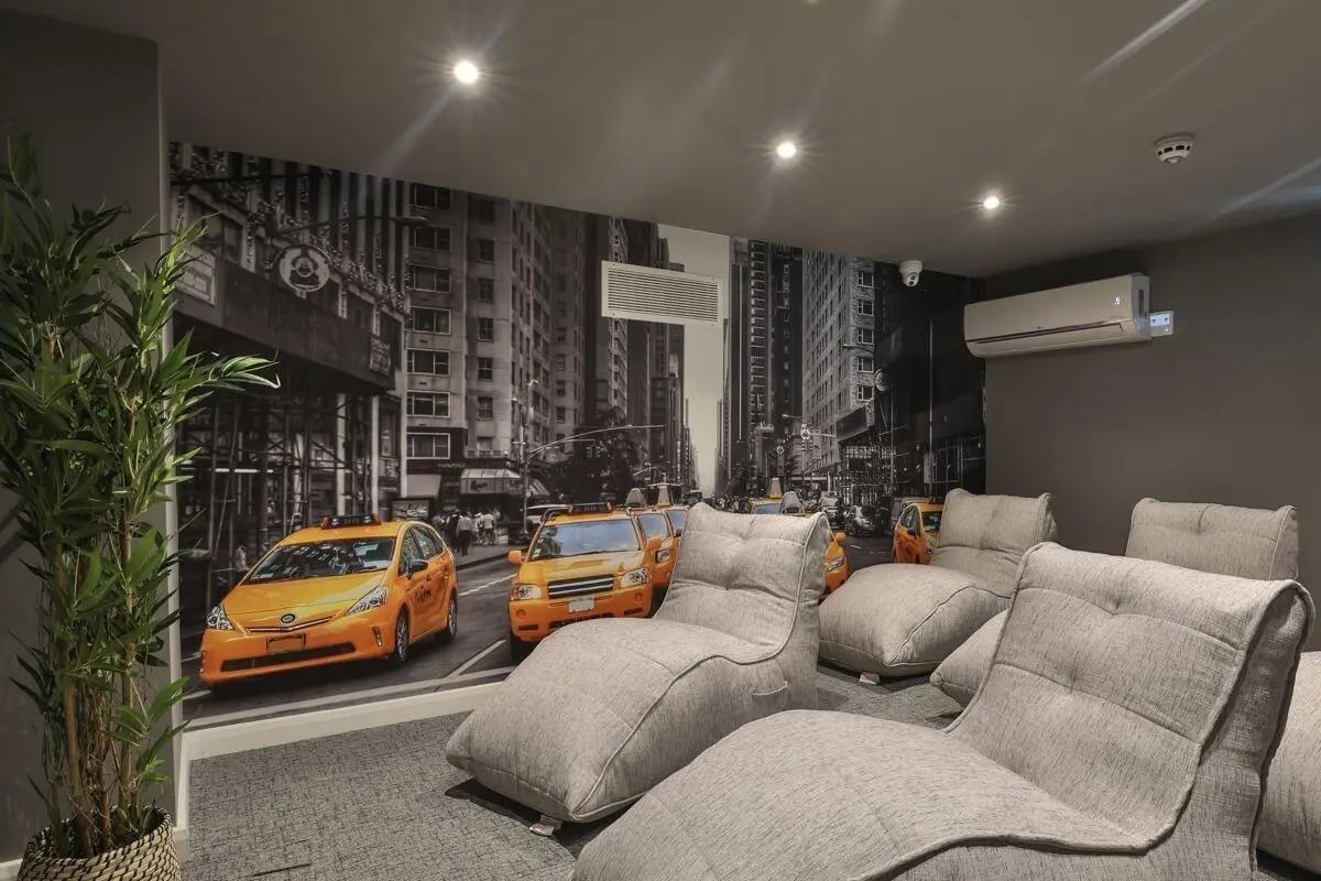 Bean bags facing New York taxi mural living room at 140 New Walk Leicester in Leicester Student Accommodation