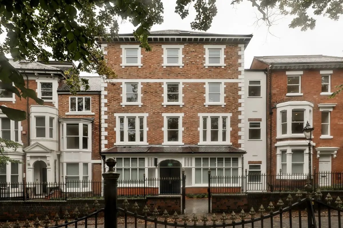 Brick building with multiple windows and entrance exterior at 140 New Walk Leicester in Leicester Student Accommodation