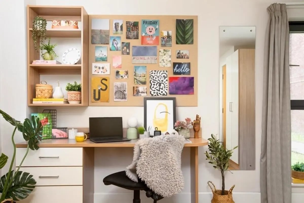 Desk with laptop plants and photos study area at Kelvin Court in Glasgow Student Accommodation