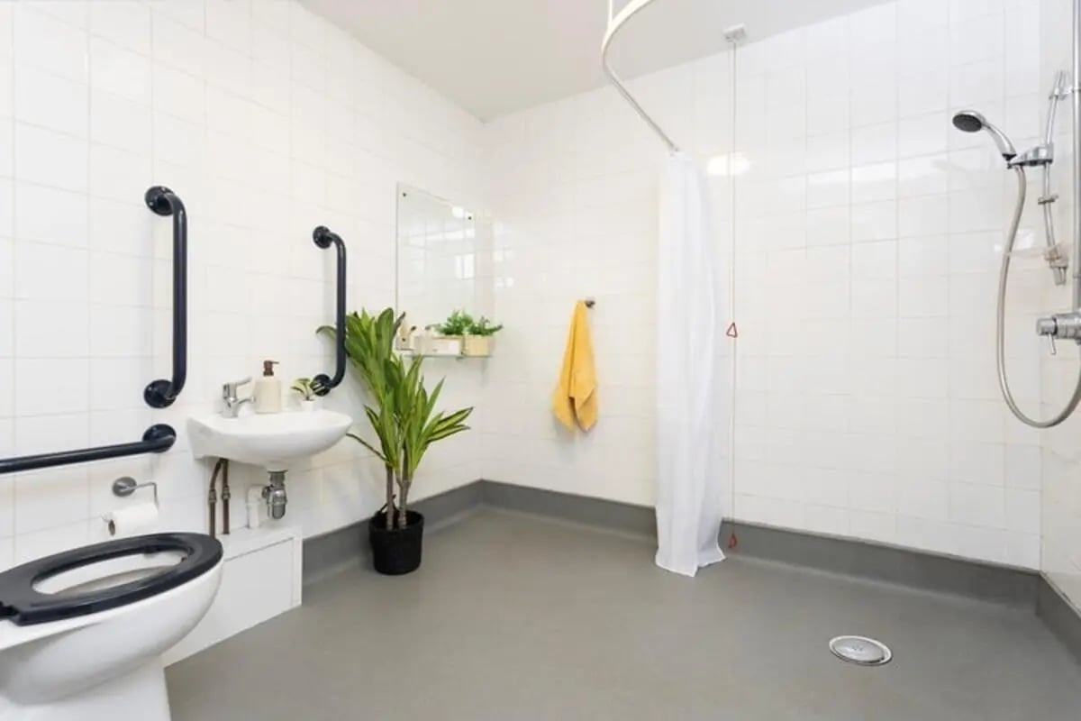 Toilet sink shower grab bars plant bathroom at Thurso Street in Glasgow Student Accommodation