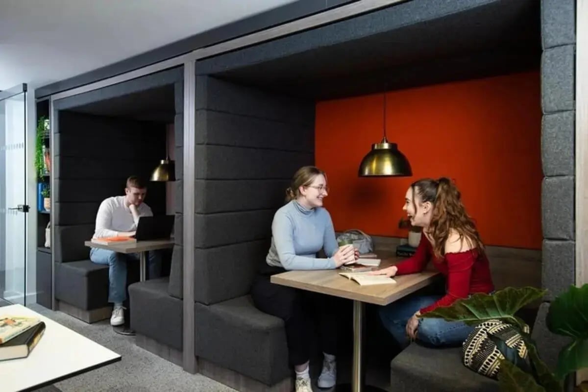 Students study in private booths lounge study area at Kyle Park House in Glasgow Student Accommodation