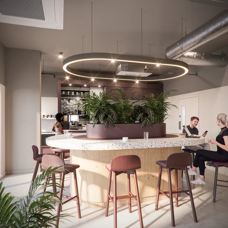 Circular counter with plants and stools communal area at Burnet Court in Edinburgh Student Accommodation
