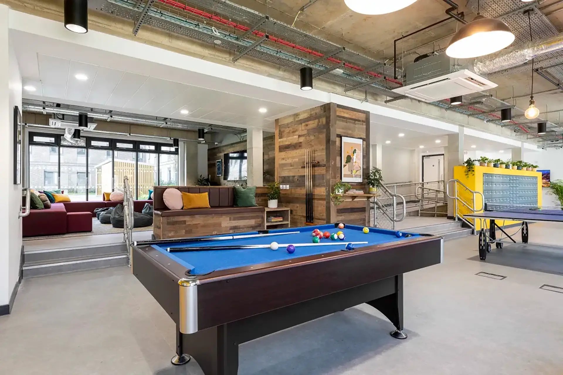Pool table ping pong table lounge area communal space at Riverside  in Canterbury Student Accommodation