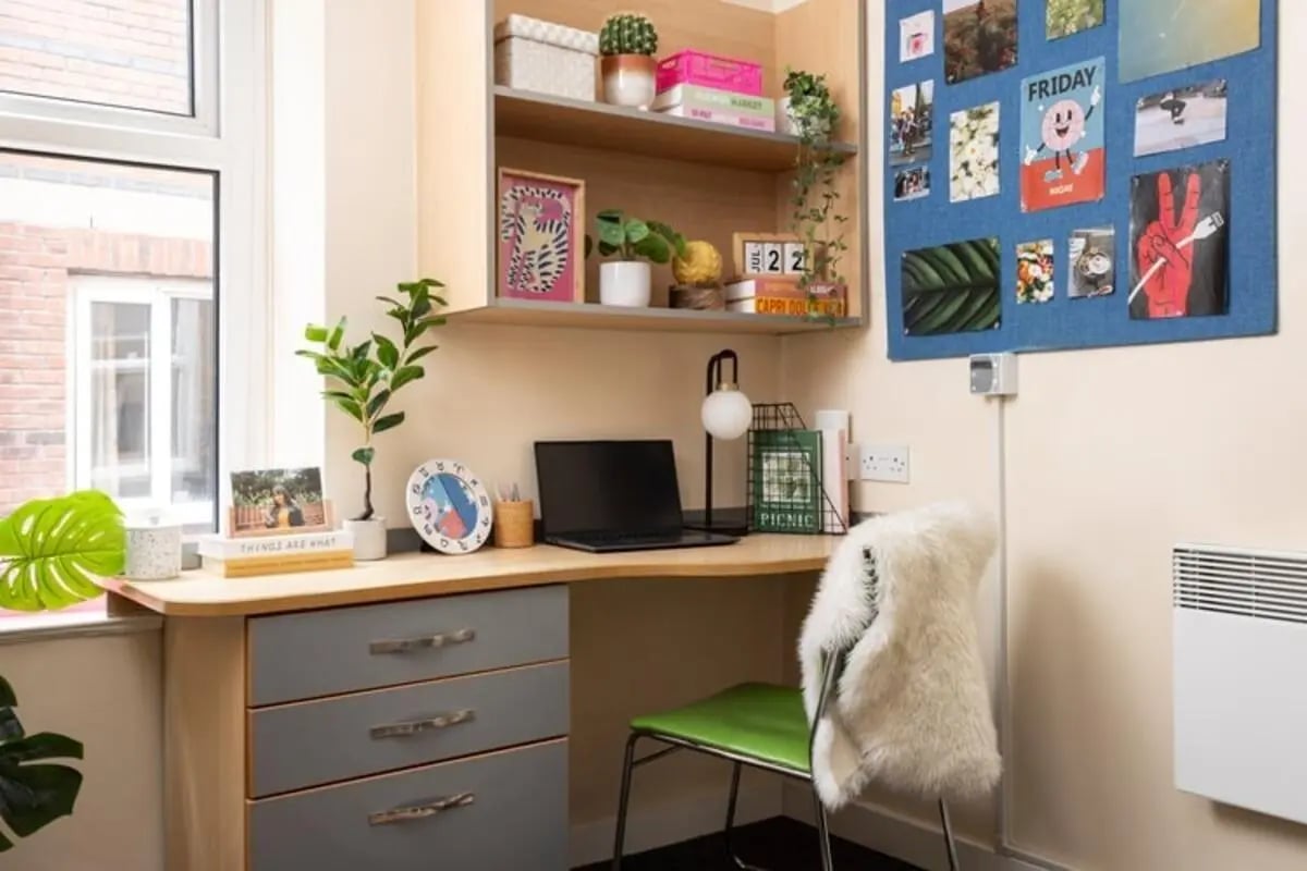Desk with laptop plants and chair study area at Lennon Studios in Liverpool Student Accommodation