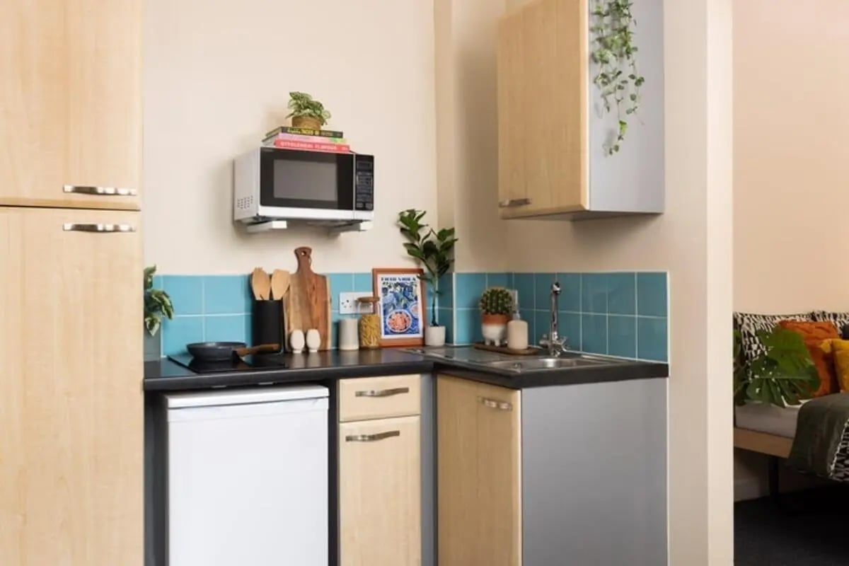 Microwave fridge sink cabinets and cooking area kitchen at Lennon Studios in Liverpool Student Accommodation