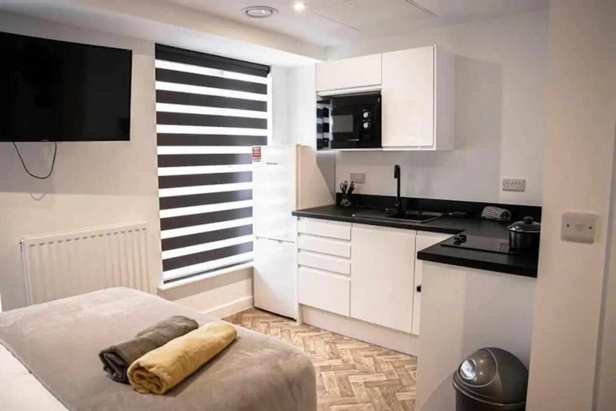 Bed television radiator kitchen area studio apartment at Bridge Street Studios in Birmingham Student Accommodation