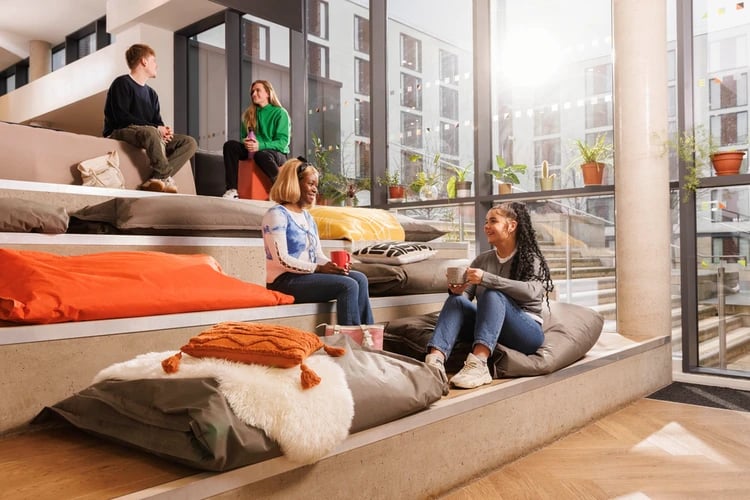 Students relaxing on beanbags in communal area at Salisbury court in Edinburgh Student Accommodation