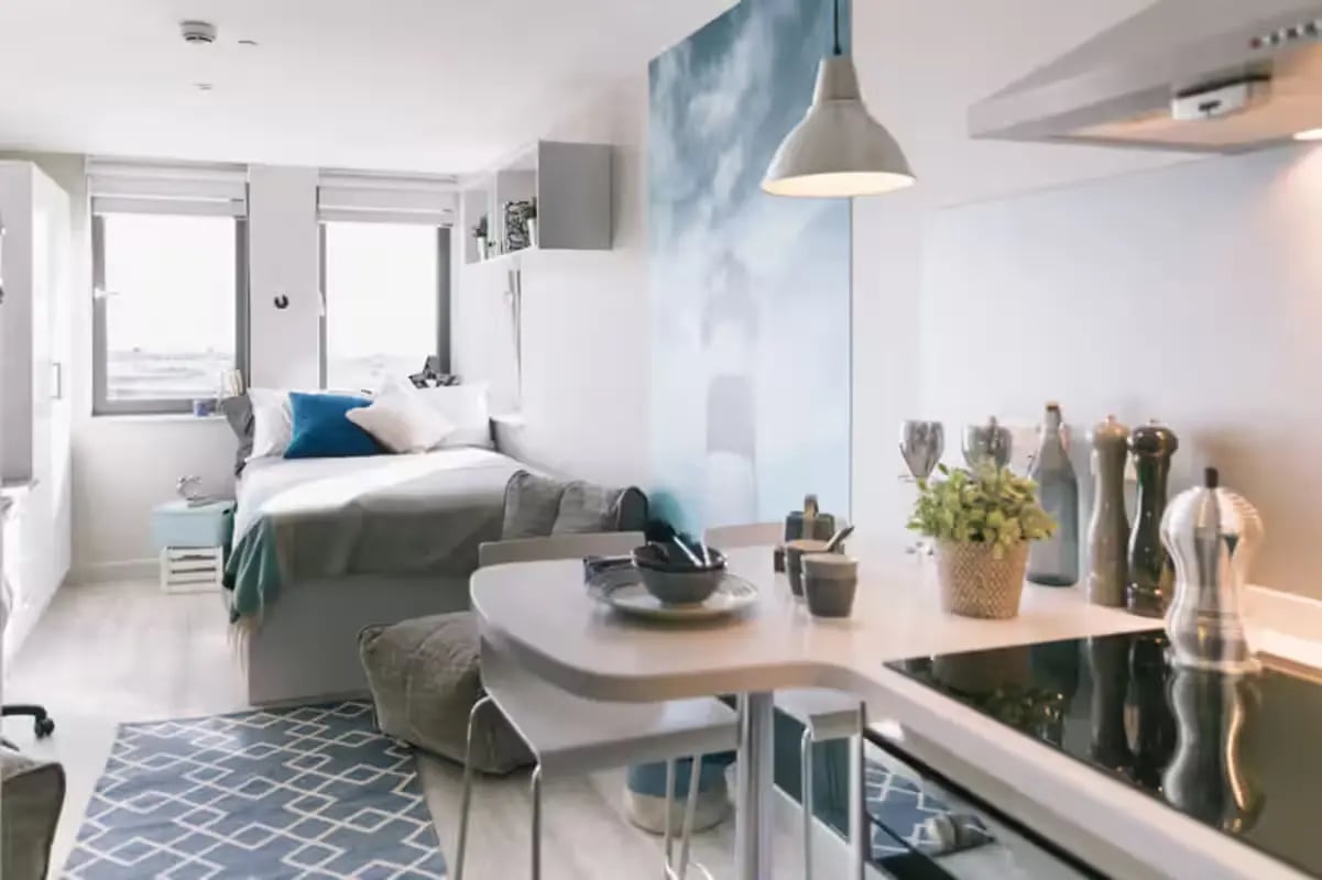 Bed desk and kitchen area studio apartment at Europa House in Portsmouth Student Accommodation