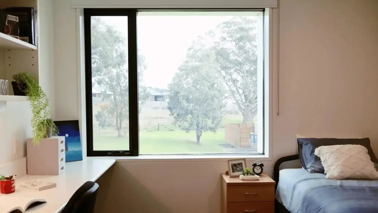 Desk bed and window view bedroom at La Trobe University - McFarlane's Hill Residences in Wodonga Student Accommodation