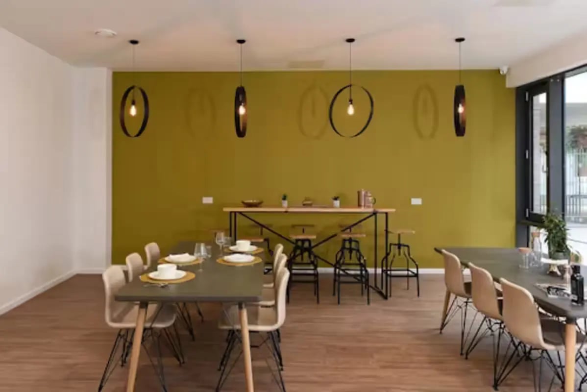Dining tables chairs high bar with stools communal area at St Mungo's in Glasgow Student Accommodation