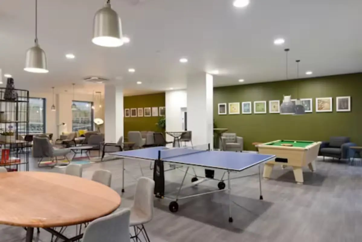 Ping pong and pool tables lounge area living room at St Mungo's in Glasgow Student Accommodation