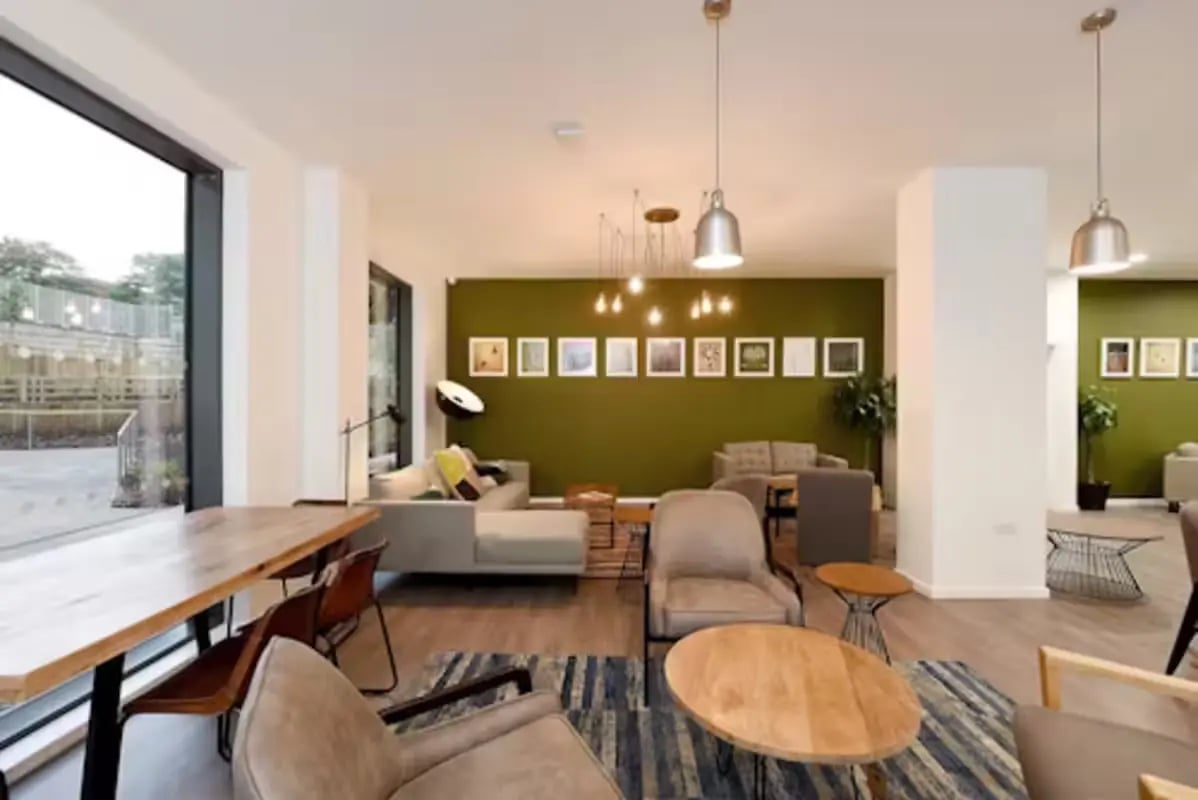 Comfortable seating and tables in common area at St Mungo's in Glasgow Student Accommodation
