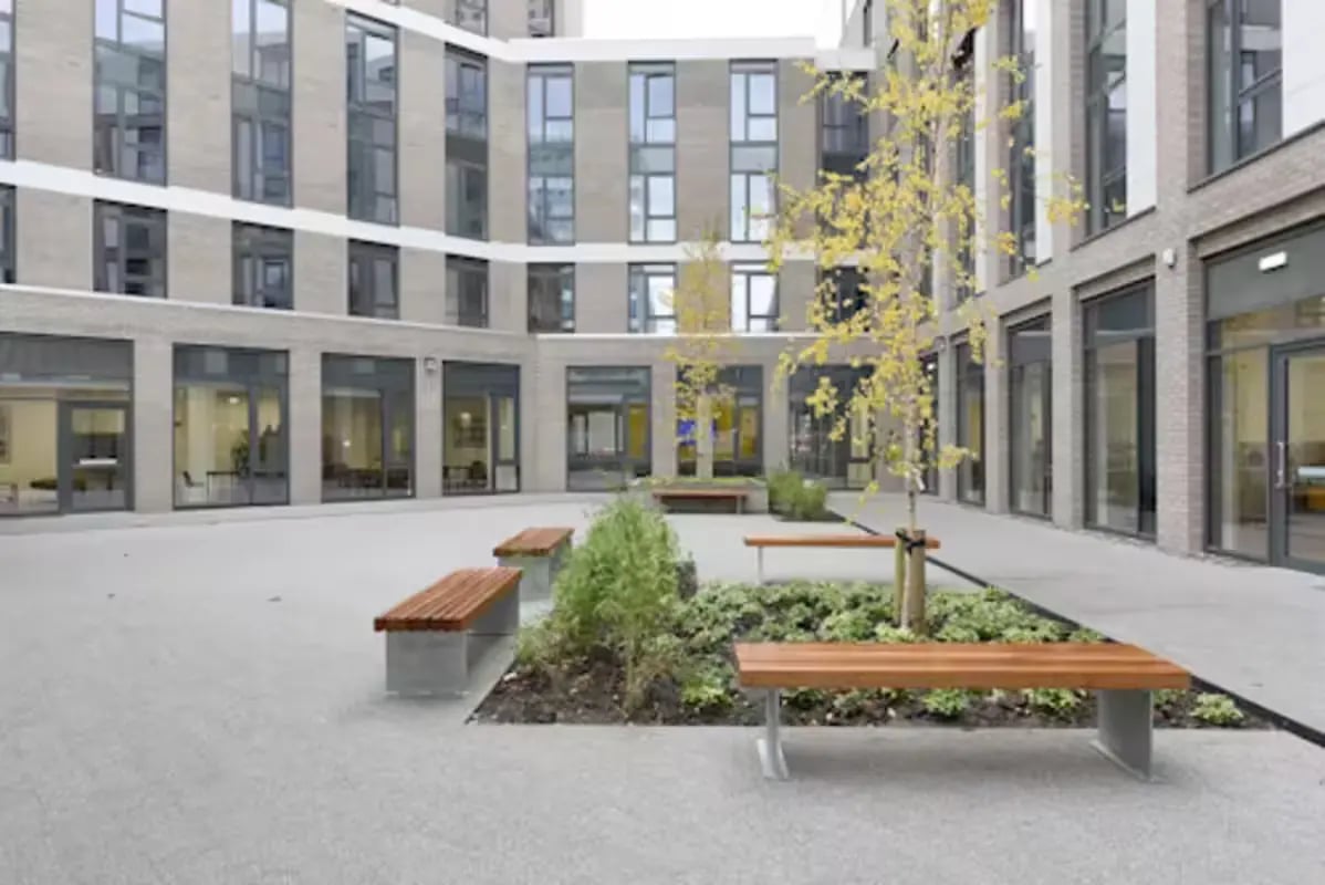 Courtyard with benches and trees exterior at St Mungo's in Glasgow Student Accommodation
