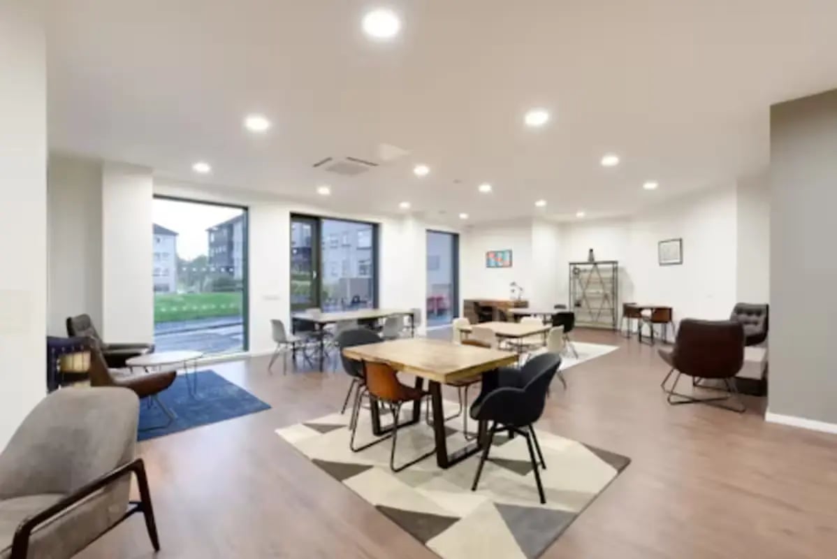 Tables chairs and seating areas common area at St Mungo's in Glasgow Student Accommodation