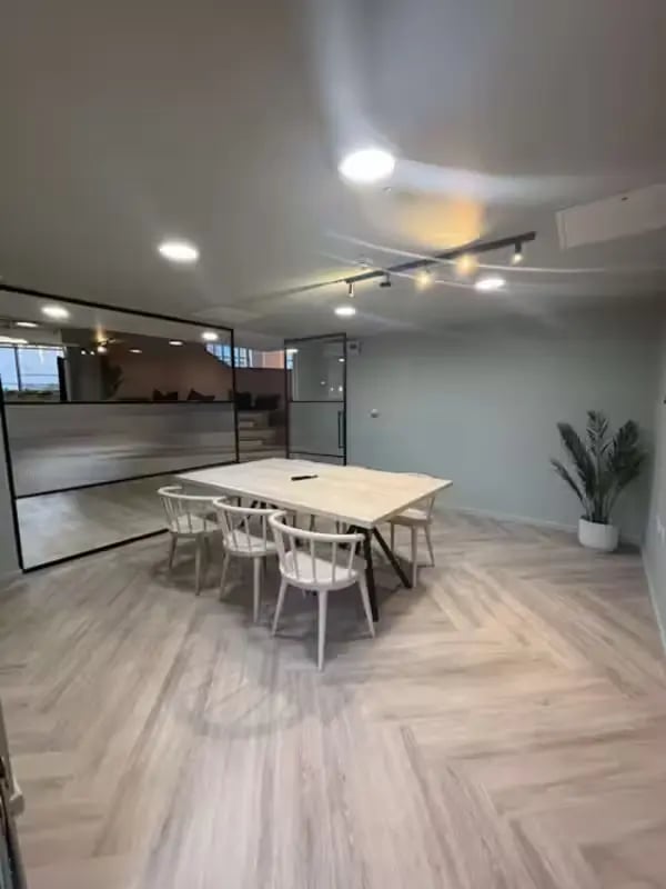 Table with chairs and glass wall communal area at Dobbie's Point in Glasgow Student Accommodation