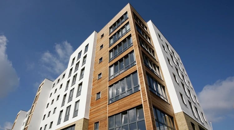 Modern building with many windows and wood exterior exterior at Beaumont Court in London Student Accommodation