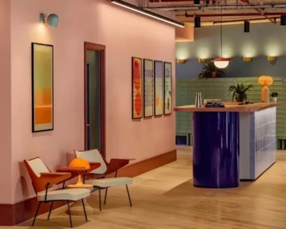 Modern lounge with chairs and bar area at Scape Hammersmith in London Student Accommodation