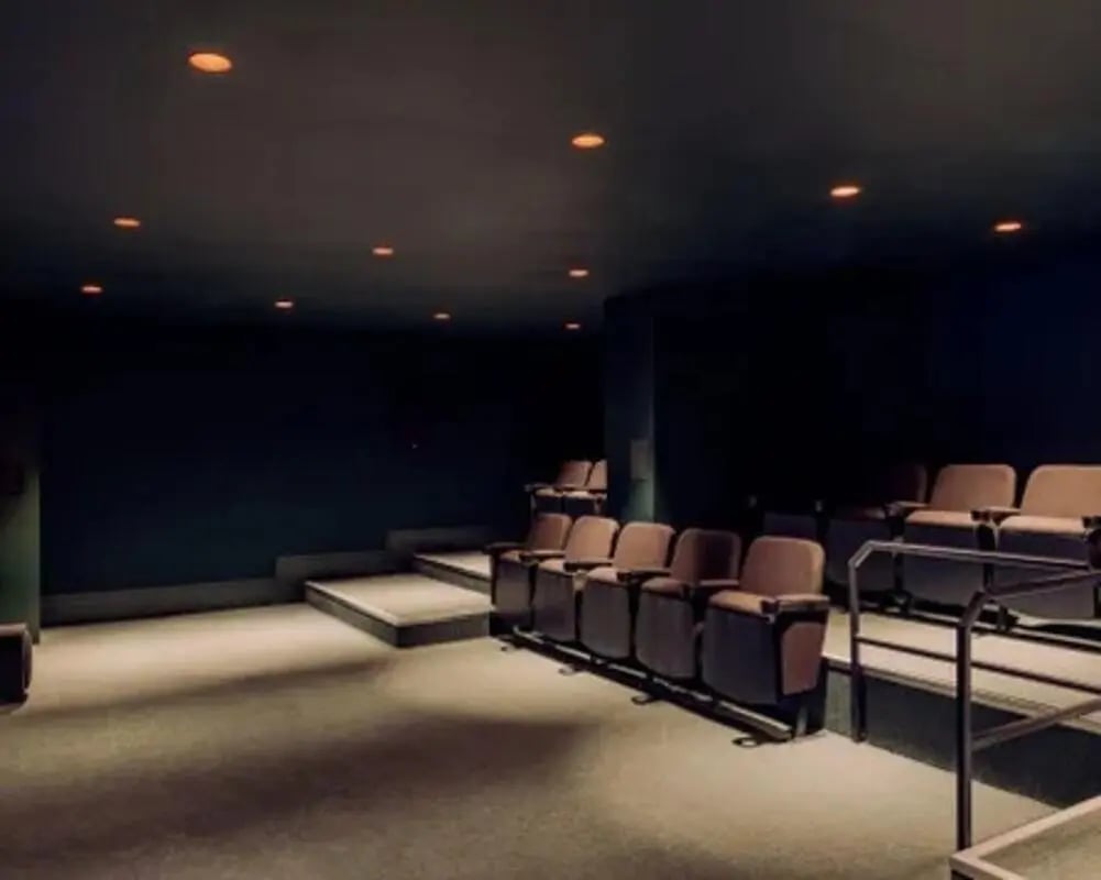 Tiered seating with rows of chairs theatre room at Scape Hammersmith in London Student Accommodation