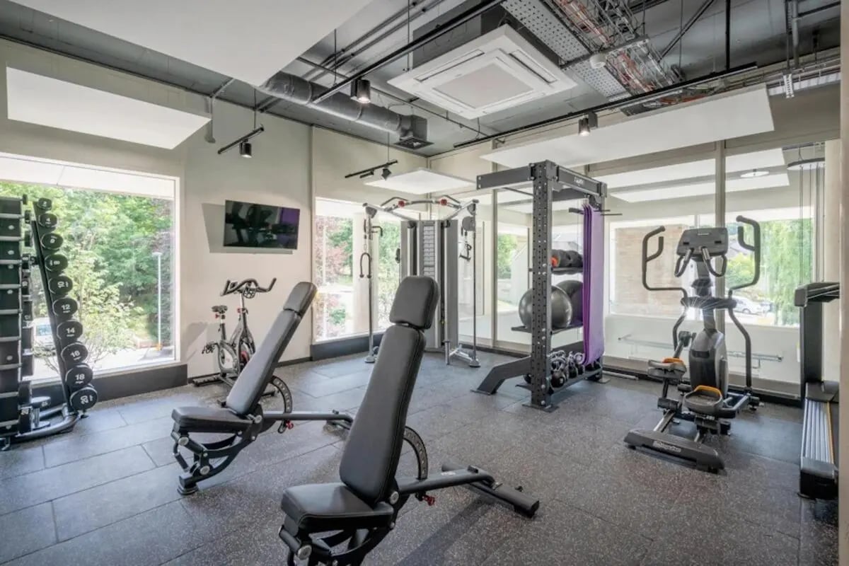 Weight rack benches cardio machines gym area at Hillfort House in Brighton Student Accommodation