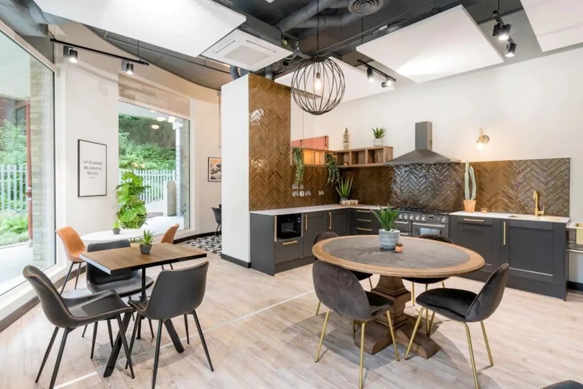 Modern kitchen with dining area common room at Hillfort House in Brighton Student Accommodation