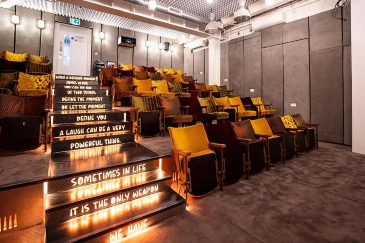 Tiered seating with quotes and cushions cinema at The Stay Club North Acton in London Student Accommodation