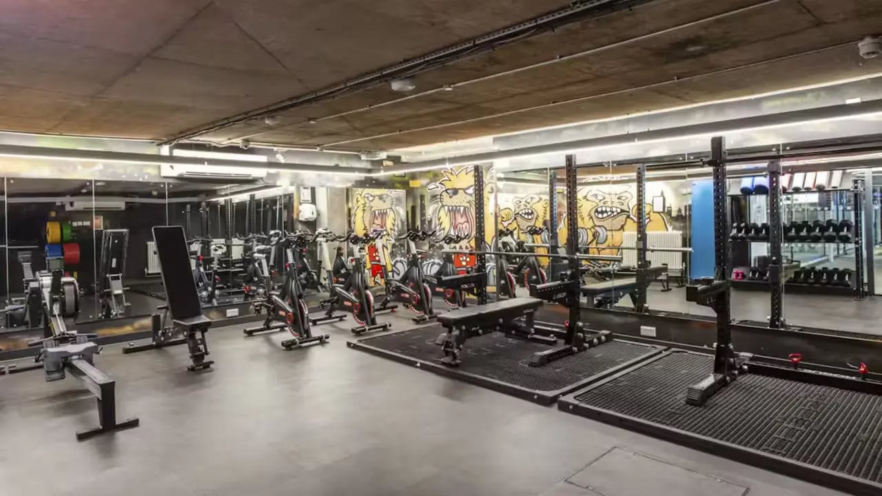 Rowing machines stationary bikes weight benches gym equipment playing area at Berkshire House Reading in Reading Student Accommodation