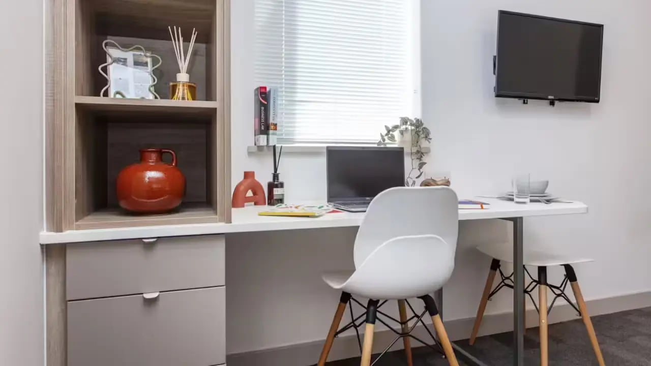 Desk with laptop chair and shelves study area at Berkshire House Reading in Reading Student Accommodation