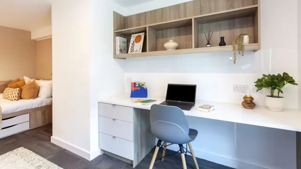 Desk with laptop shelves and bed Bedroom at Gillows in Lancaster Student Accommodation