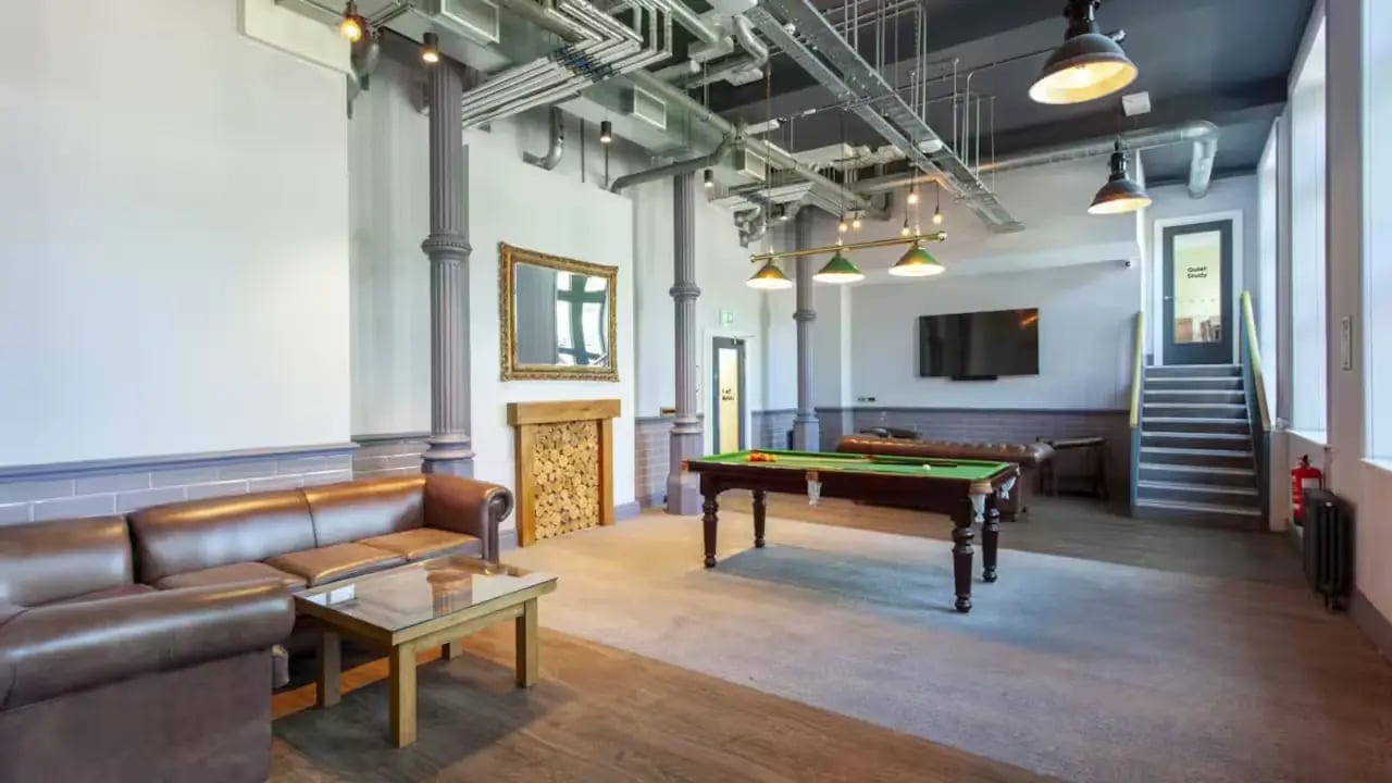 Leather sofas pool table fireplace common room at Gillows in Lancaster Student Accommodation