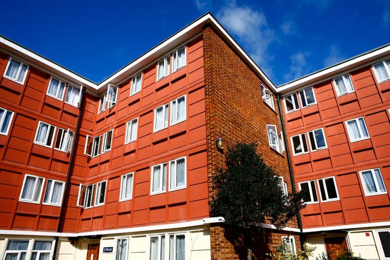 Orange brick building with multiple windows exterior at Brooke Hall in London Student Accommodation