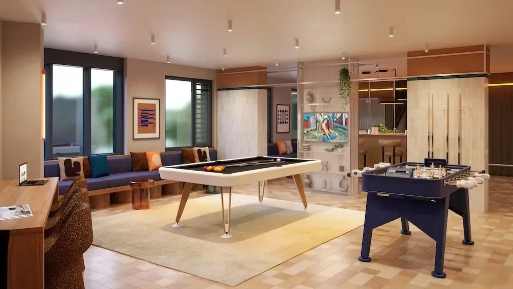 Pool table foosball table lounge area living room at Ironworks House in London Student Accommodation