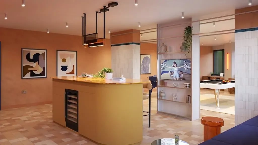 Kitchen island bar and pool table common room at Ironworks House in London Student Accommodation