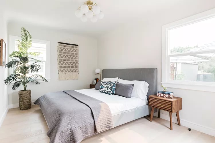 Bed with grey throw plant and tapestry bedroom at 125 Leek Road in Stoke-On-Trent Student Accommodation