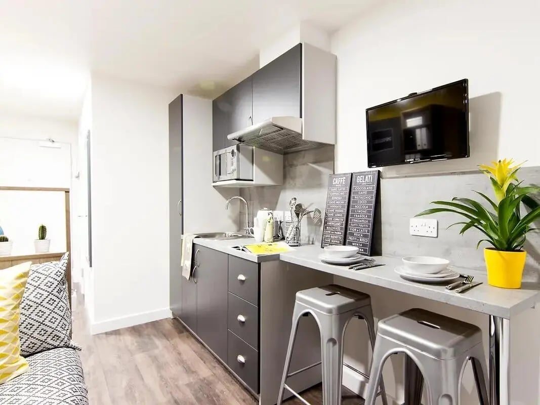 Modern kitchen with microwave sink and breakfast bar kitchen at Yugo Catherine House in Portsmouth Student Accommodation