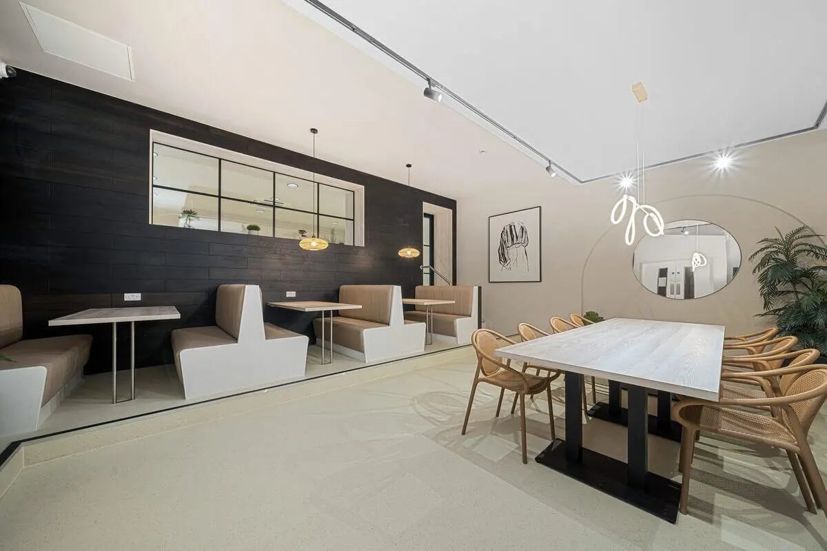 Booths tables chairs modern communal area living room at Cathedral Park in Bristol Student Accommodation