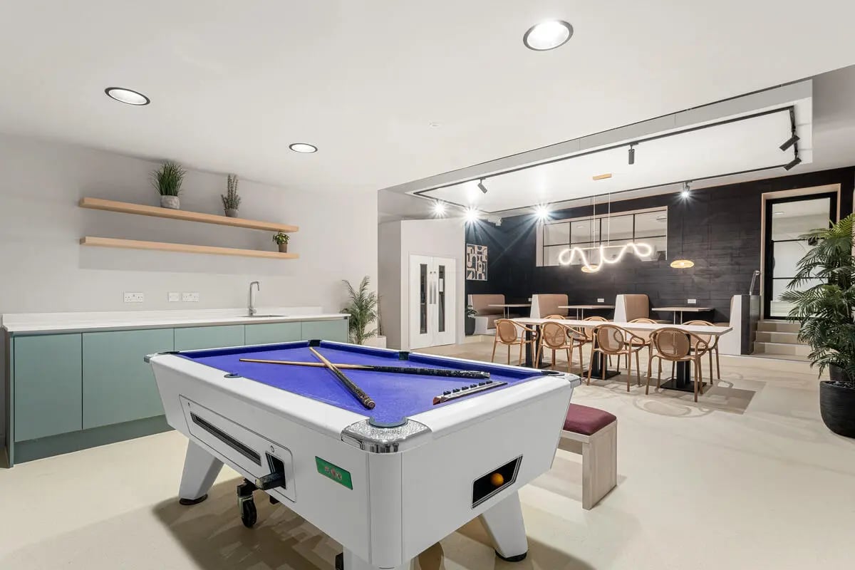 Pool table kitchen area dining area lounge at Cathedral Park in Bristol Student Accommodation