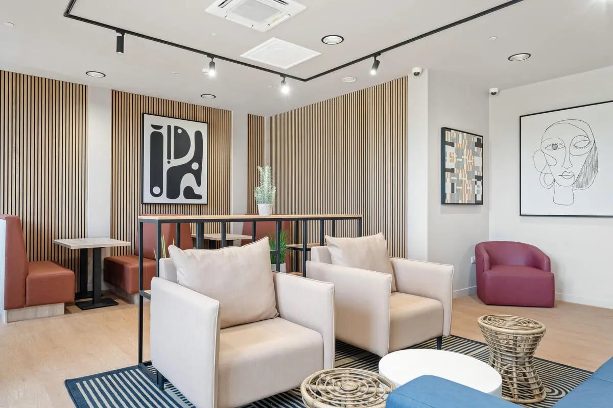 Two armchairs and booth seating in lounge at Cathedral Park in Bristol Student Accommodation