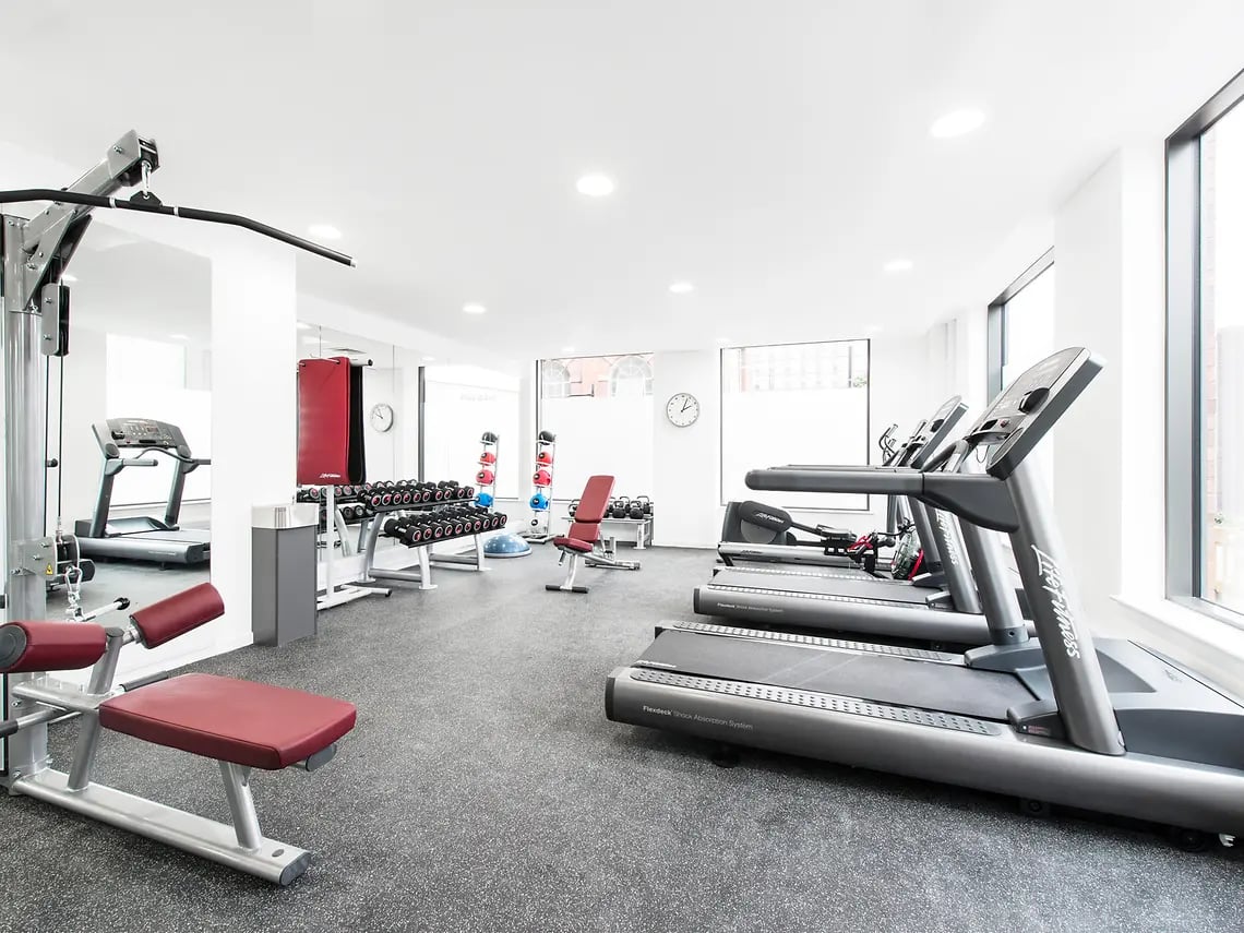 Treadmills weight racks and gym equipment gym room at Yugo Bentley House in Birmingham Student Accommodation