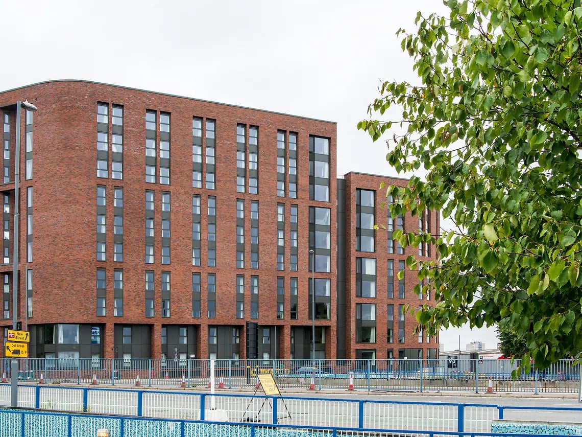 Brick student accommodation building with many windows exterior at Yugo Bentley House in Birmingham Student Accommodation