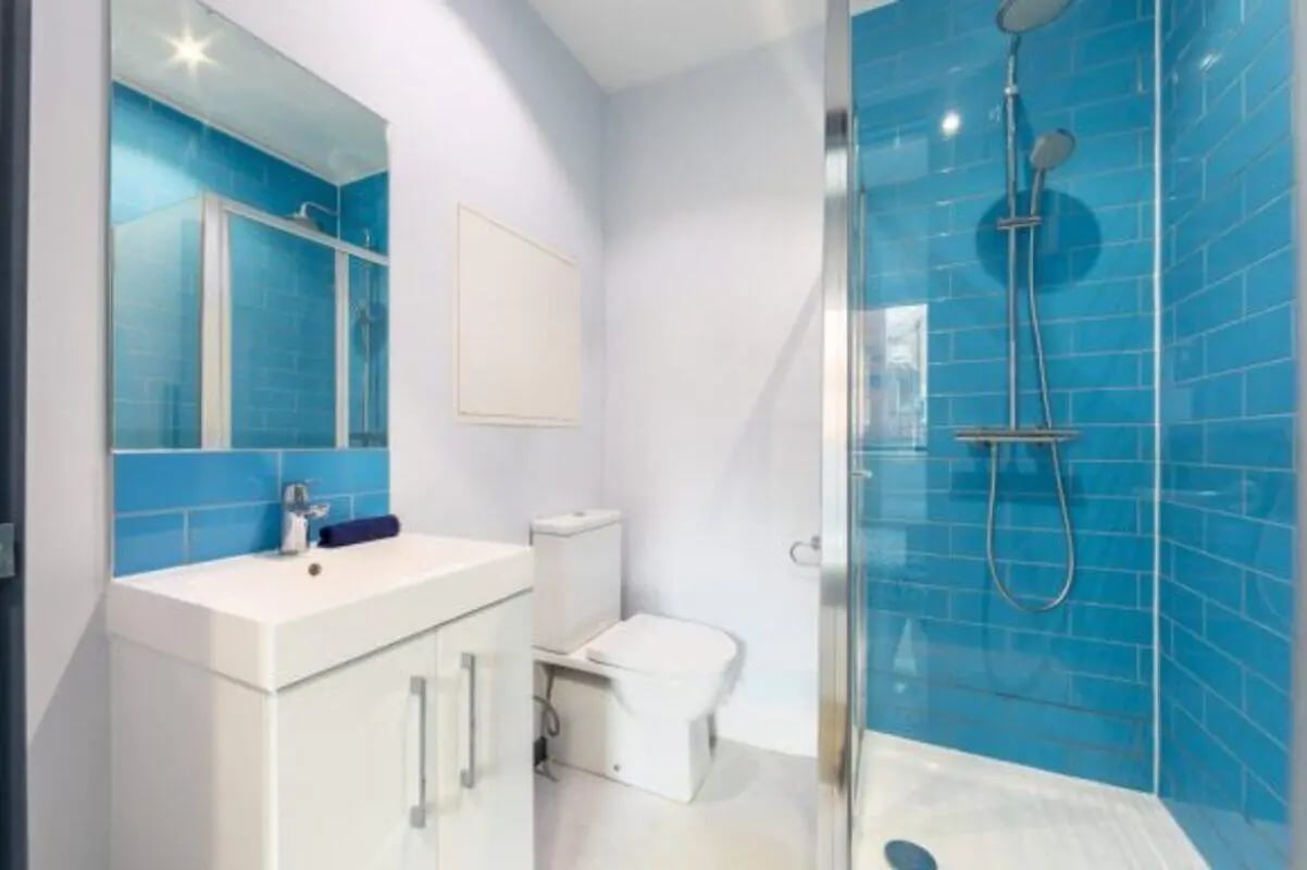 Sink toilet shower blue tiled bathroom at dwell Archer House in Nottingham Student Accommodation