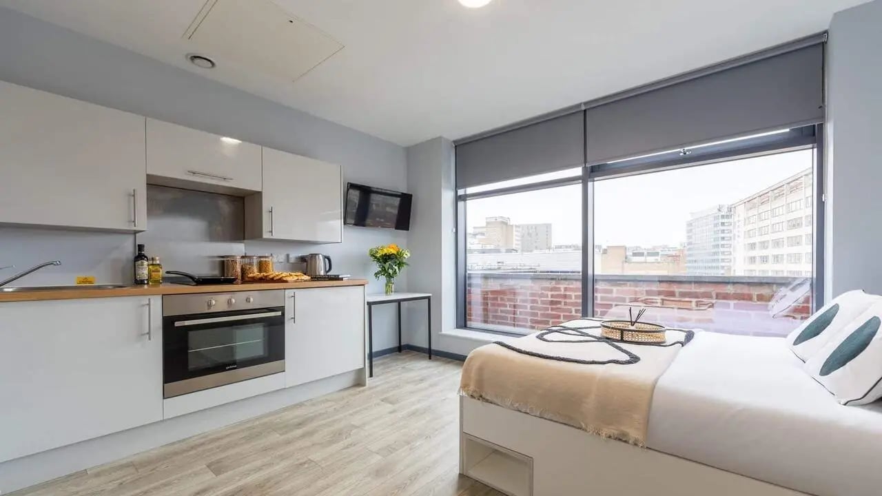 Kitchen counter oven and bed bedroom at dwell Archer House in Nottingham Student Accommodation