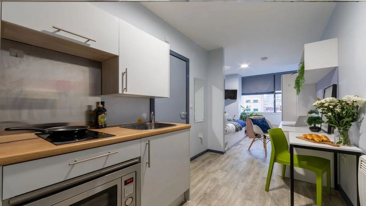 Kitchenette with cooking area and bed area at dwell Archer House in Nottingham Student Accommodation