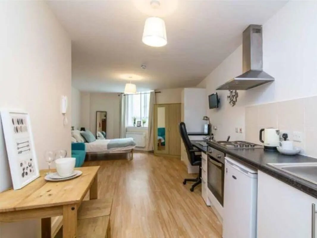 Bed desk and kitchen area studio apartment at dwell Castle Gate Haus in Nottingham Student Accommodation