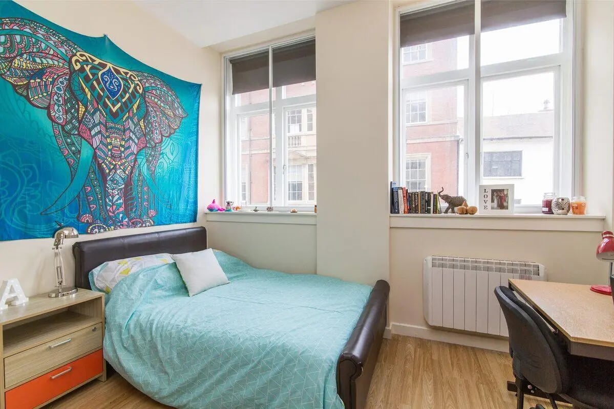 Elephant tapestry bed desk and radiator bedroom at dwell Castle Gate Haus in Nottingham Student Accommodation