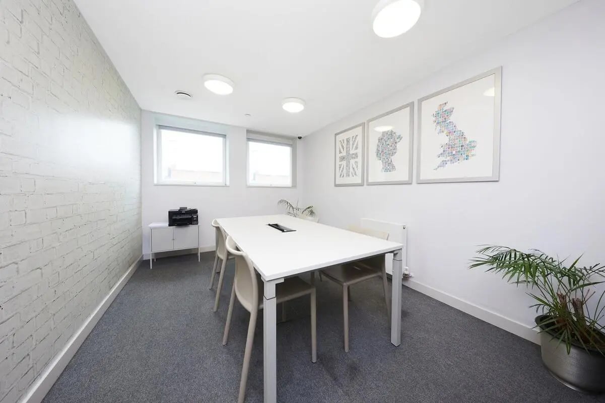 White table chairs printer framed art study area at Collegiate Park House in Southampton Student Accommodation