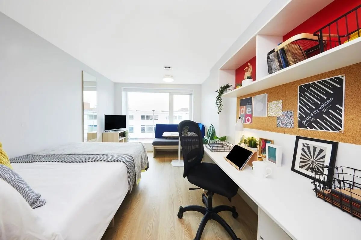 Bed desk chair and corkboard study area at Collegiate Park House in Southampton Student Accommodation