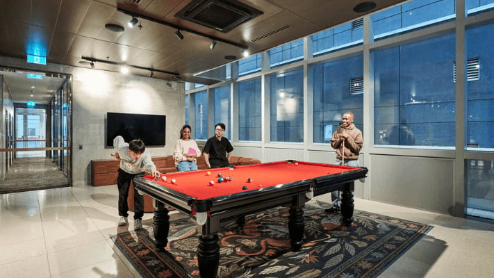People playing pool in lounge area at UniLodge Melbourne Flagstaff in Melbourne Student Accommodation