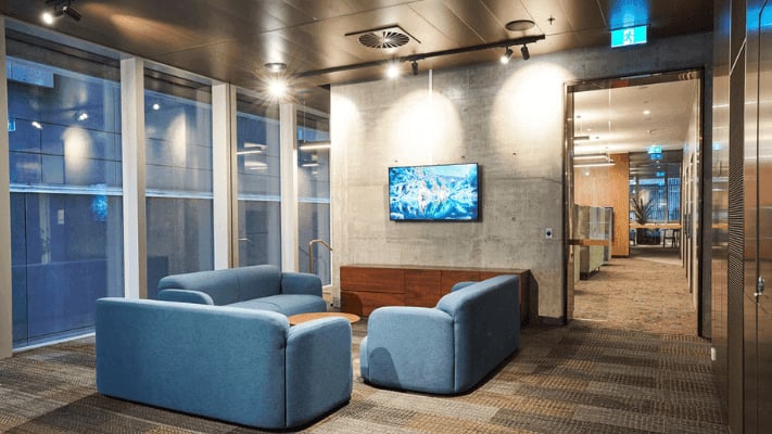 Blue sofas coffee table and TV living room at UniLodge Melbourne Flagstaff in Melbourne Student Accommodation