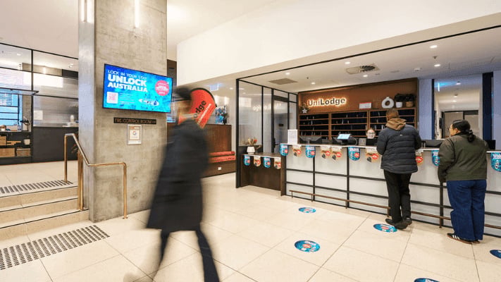 Reception desk with staff and guests lobby at UniLodge Melbourne Flagstaff in Melbourne Student Accommodation